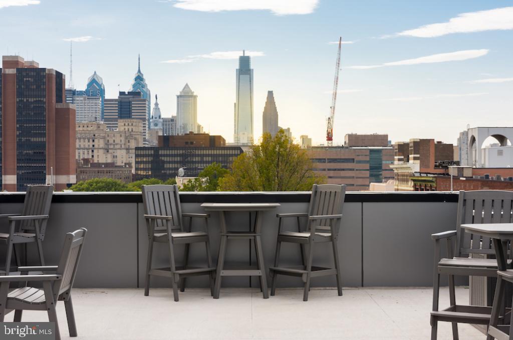 218-26 Arch Street, Unit 511 Philadelphia, PA 19106 - Photo 11 of 37 a view of a chairs and table in a terrace
