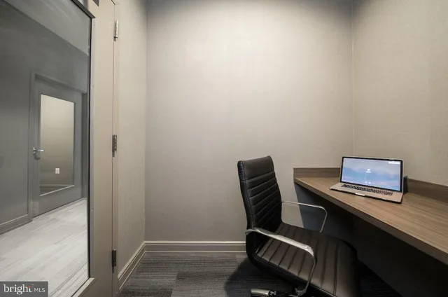 a view of a workspace with furniture