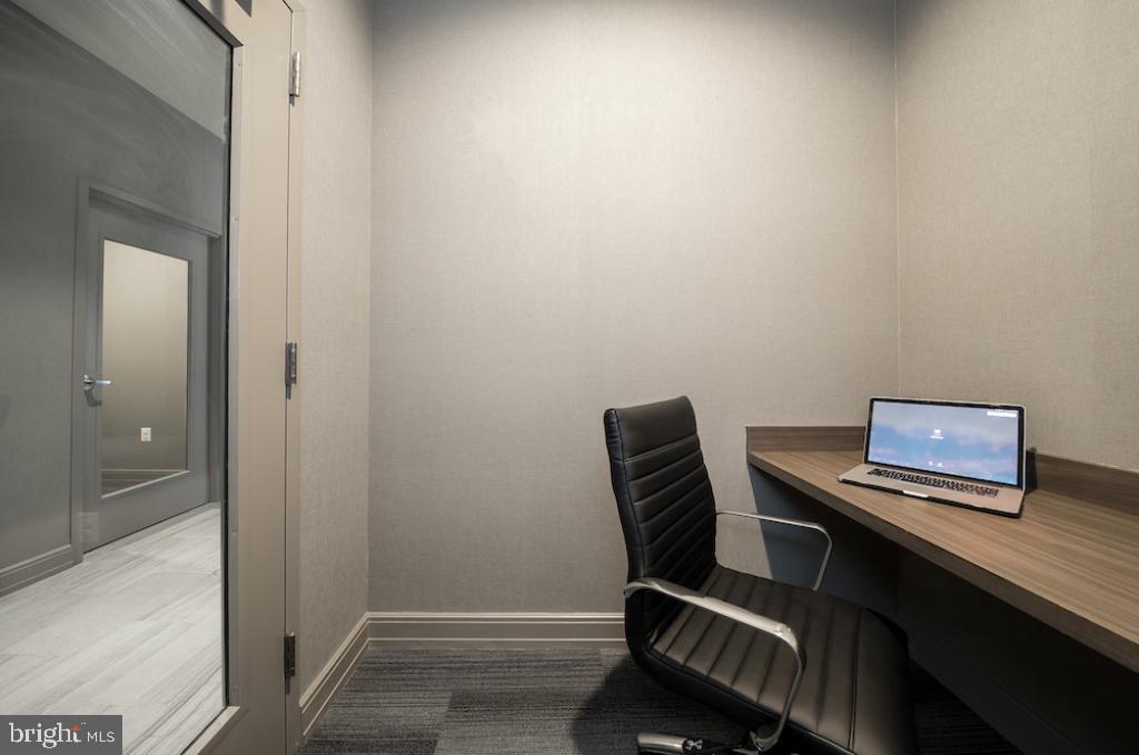 218-26 Arch Street, Unit 511 Philadelphia, PA 19106 - Photo 19 of 37 a view of a workspace with furniture