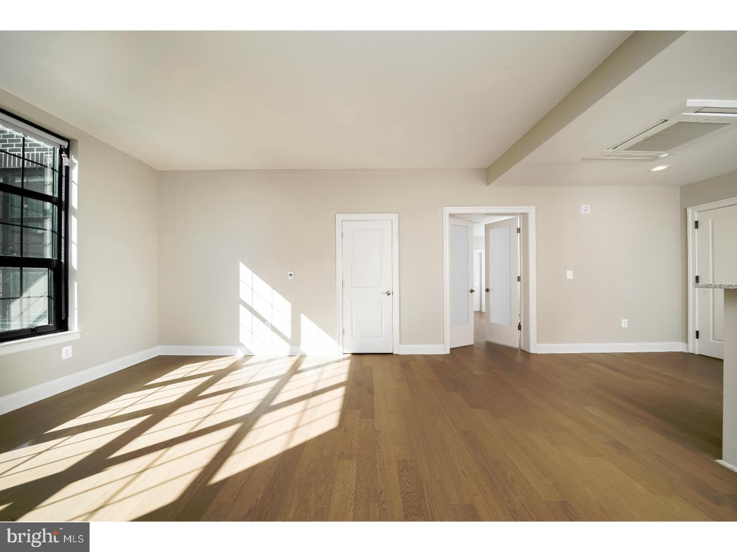 218-26 Arch Street, Unit 511 Philadelphia, PA 19106 - Photo 23 of 37 a view of an empty room and window