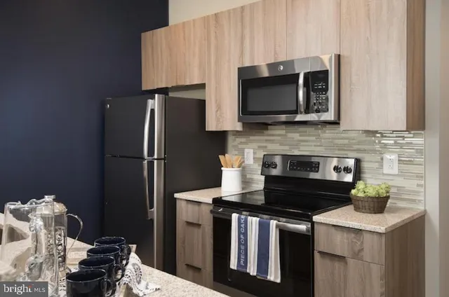 a kitchen with a stove and a microwave