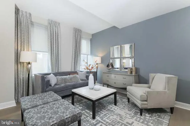 a living room with furniture and a window