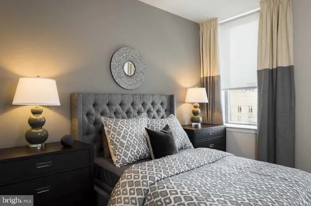 a bedroom with a bed and window