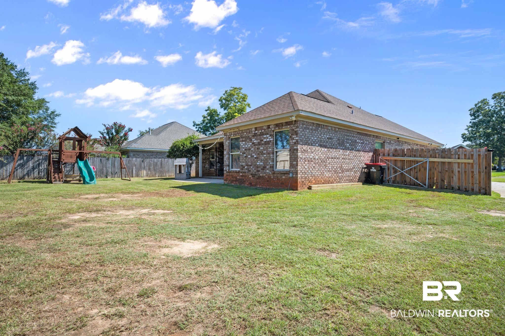 3879 Symphony Way West Semmes, AL 36575 - Photo 30 of 34 View of yard with a playground and a patio area