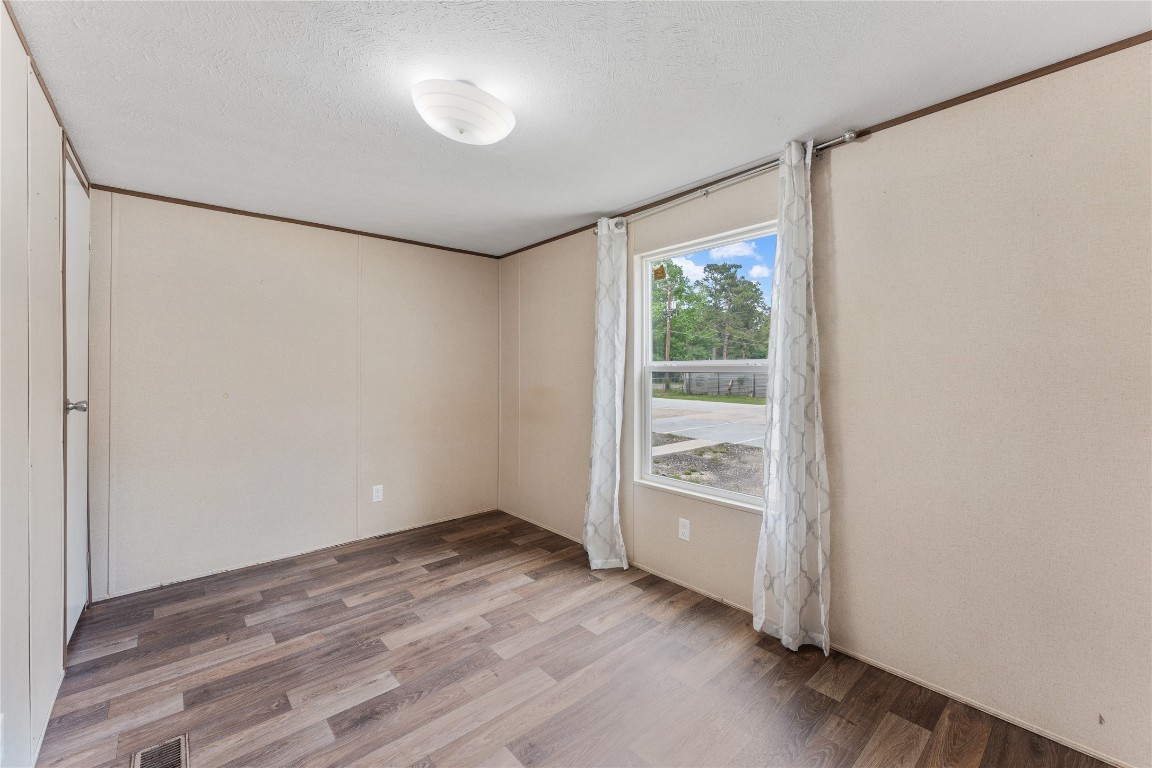 21504 Mexican John Road, Unit B New Caney, TX 77357 - Photo 10 of 13 a view of an empty room with a window