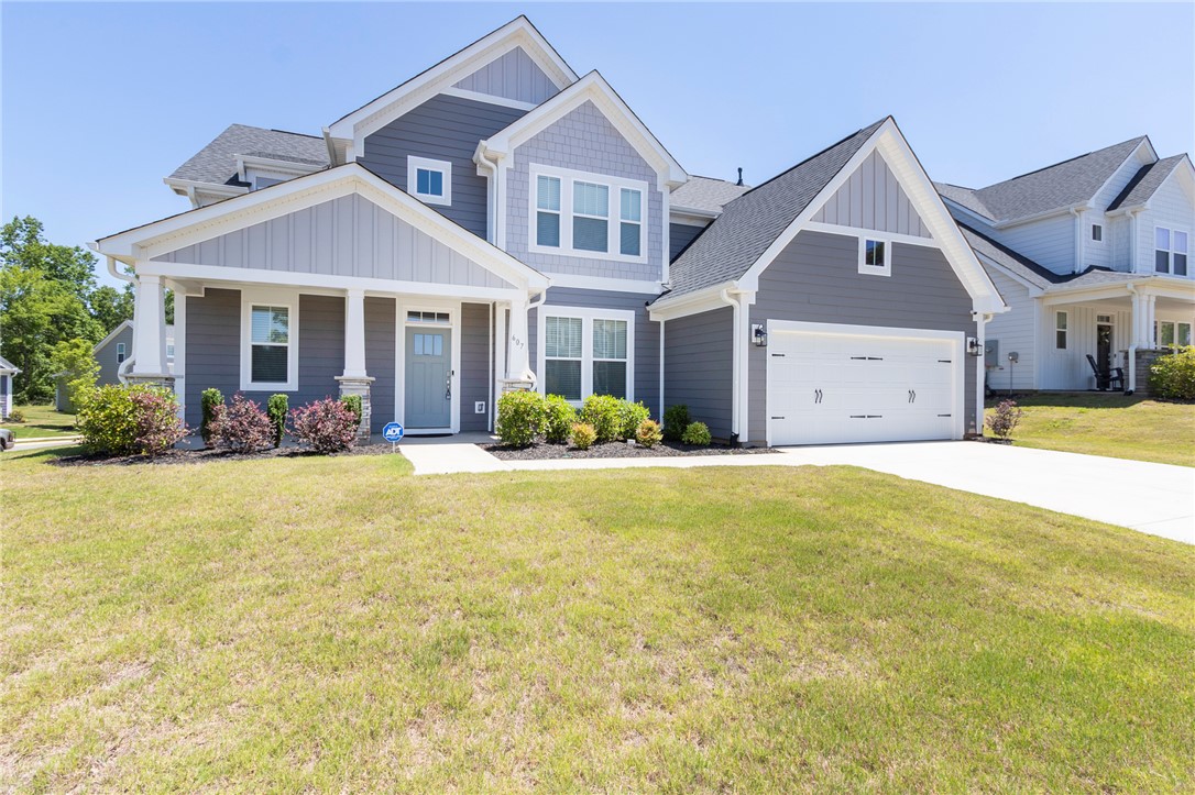 607 WH Kay Lane Anderson, SC 29621 - Photo 1 of 48 A welcoming facade showcases a mix of board and batten with shingle siding, complemented by an inviting front porch.