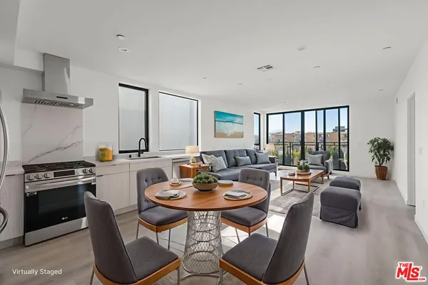a view of a dining room with furniture window and outside view