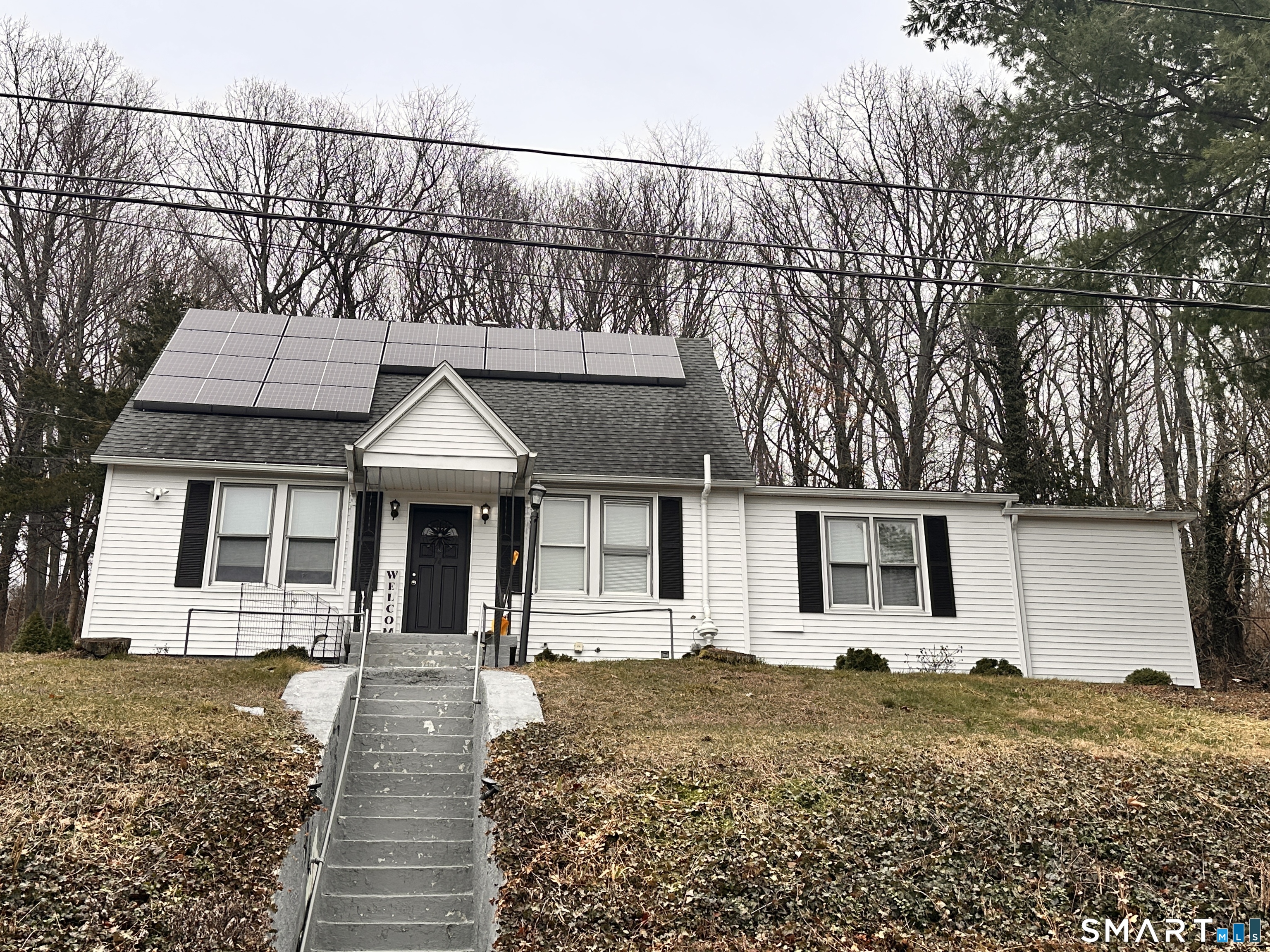 front view of a house with a yard