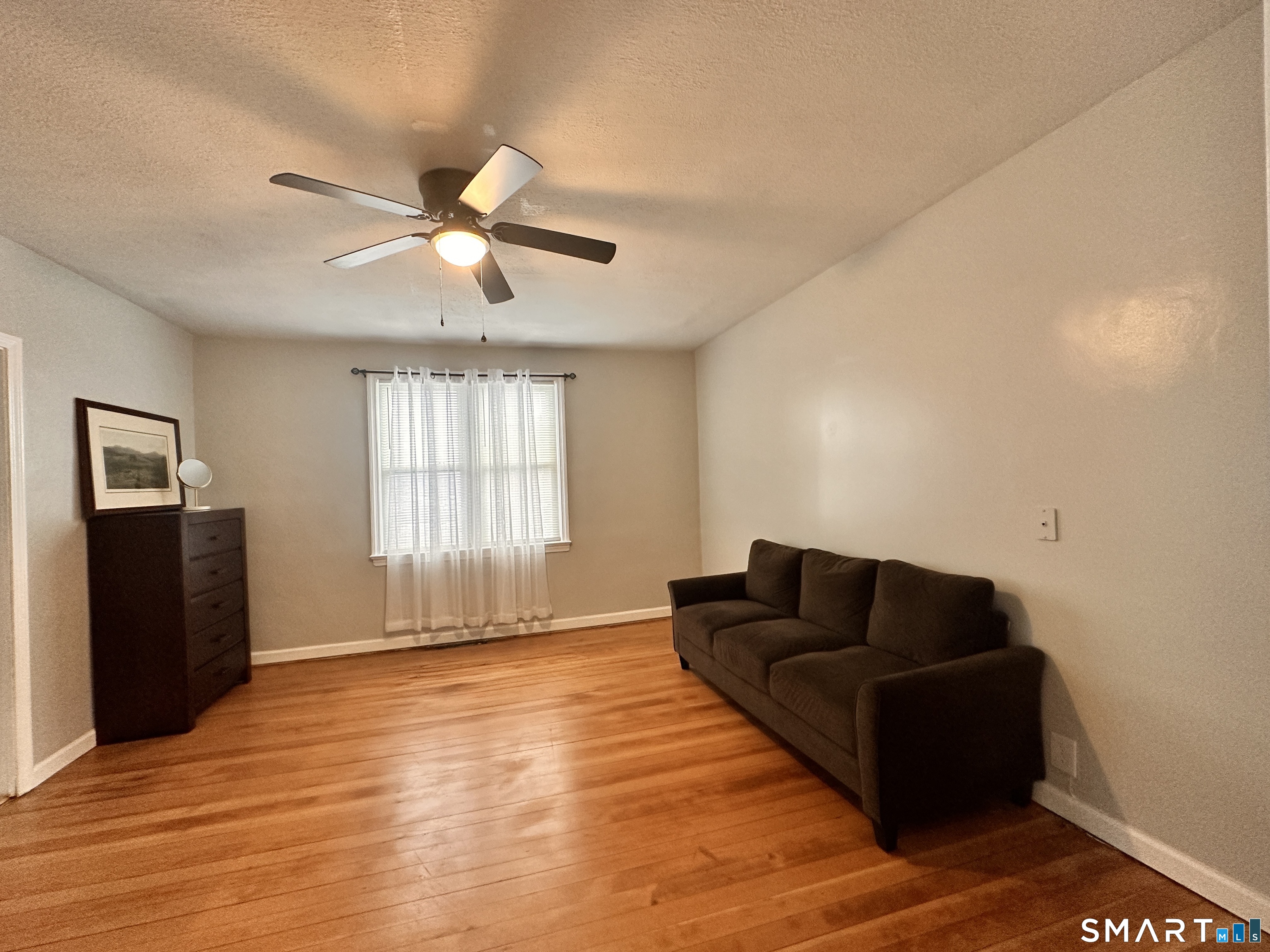 74 Mt Pleasant Street, Unit 2 Derby, CT 06418 - Photo 12 of 19 a living room with furniture and a flat screen tv