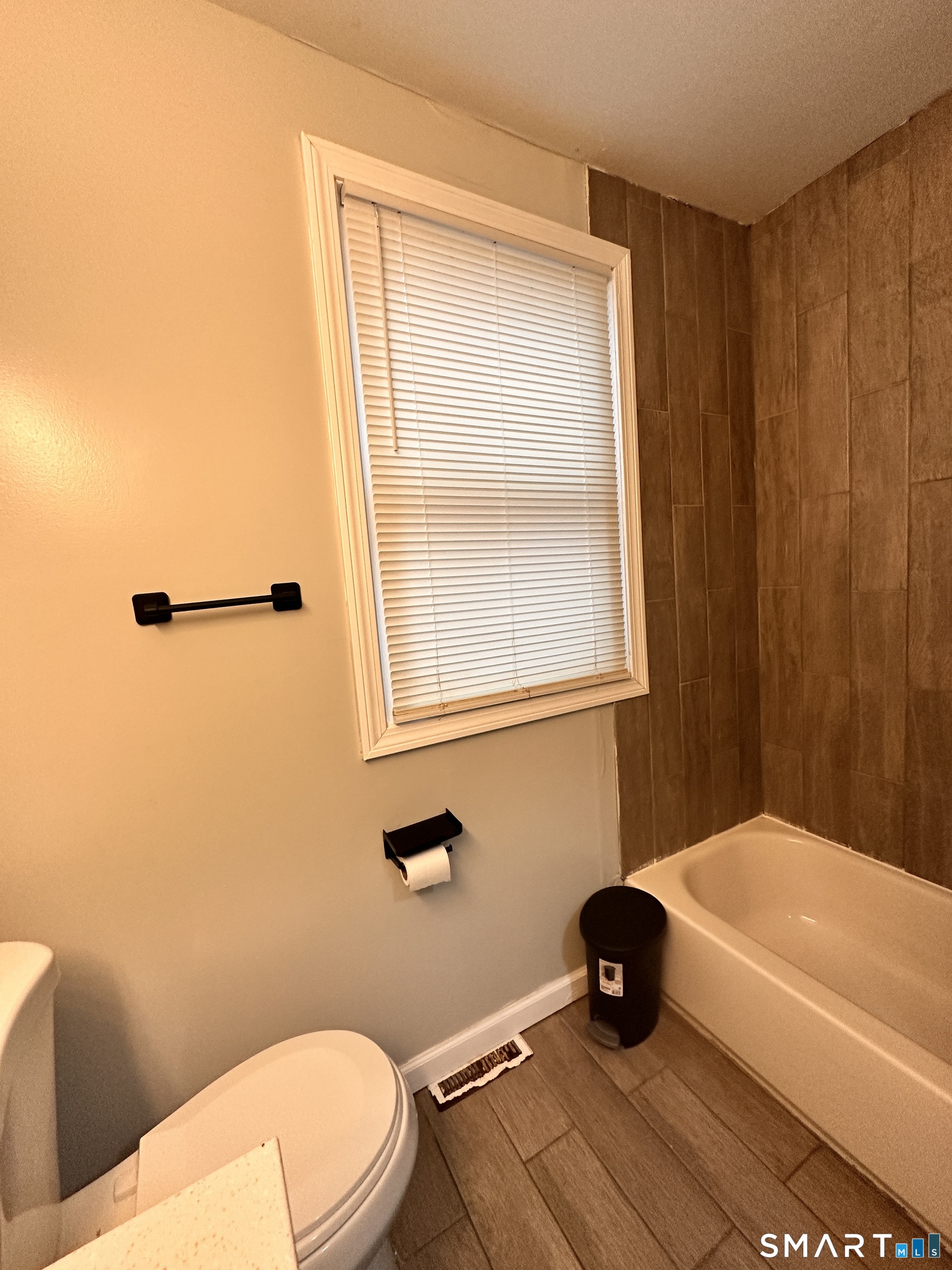 74 Mt Pleasant Street, Unit 2 Derby, CT 06418 - Photo 14 of 19 a bathroom with a toilet and a tub