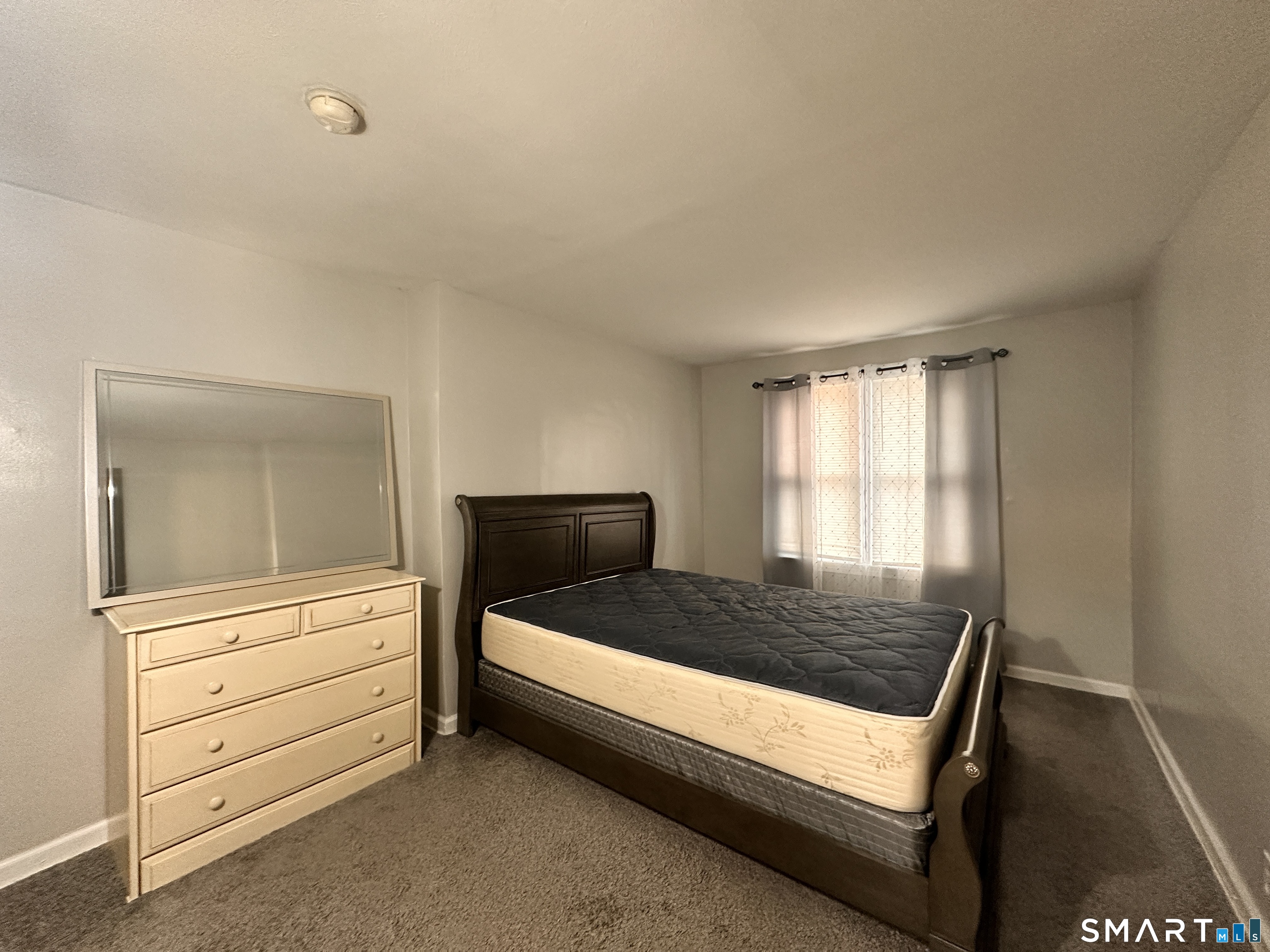 74 Mt Pleasant Street, Unit 2 Derby, CT 06418 - Photo 15 of 19 a bedroom with a bed and a window