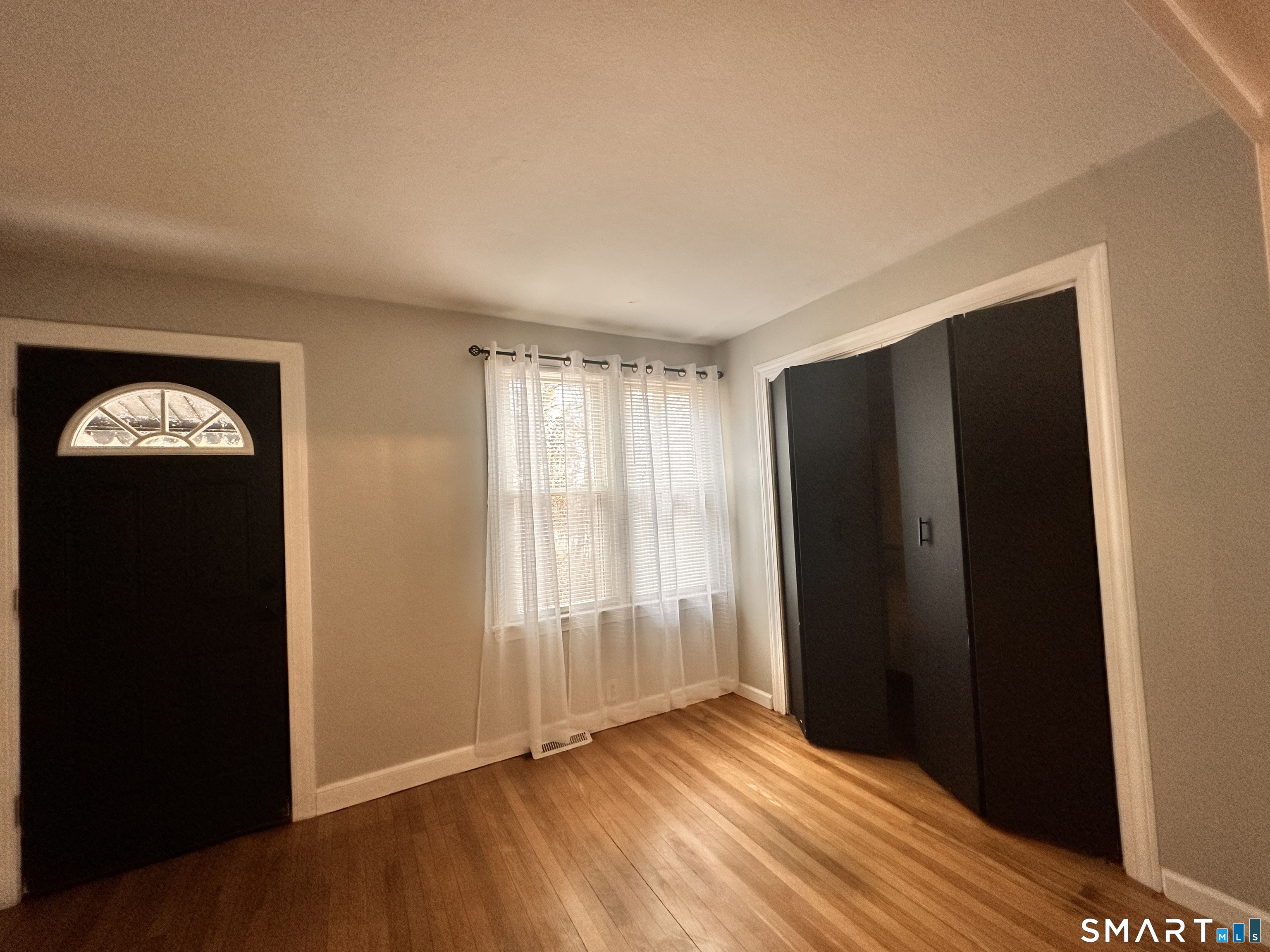 74 Mt Pleasant Street, Unit 2 Derby, CT 06418 - Photo 7 of 19 a view of entryway with wooden floor