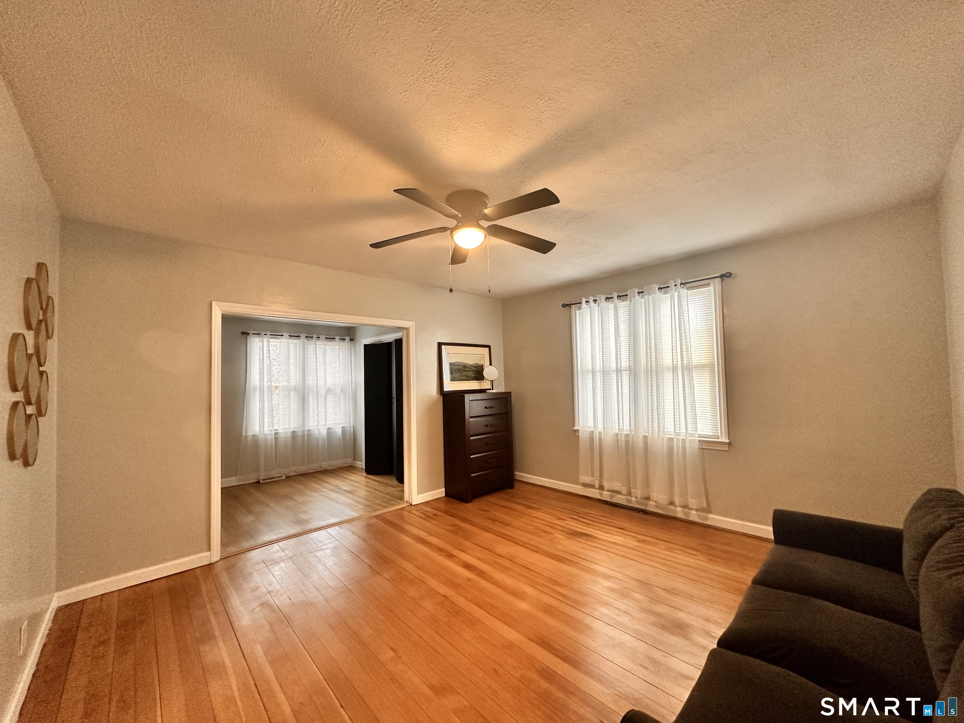 74 Mt Pleasant Street, Unit 2 Derby, CT 06418 - Photo 10 of 19 a living room with furniture and a ceiling fan