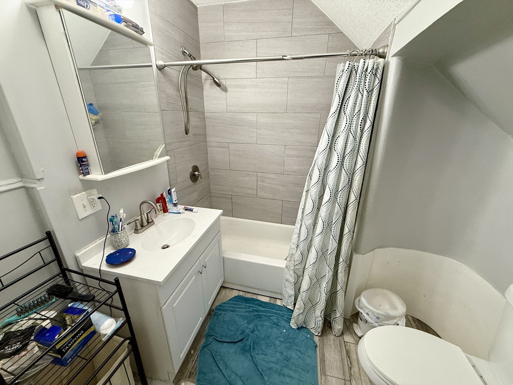 63 Langdon Street Springfield, MA 01104 - Photo 13 of 22 a bathroom with a sink toilet and shower