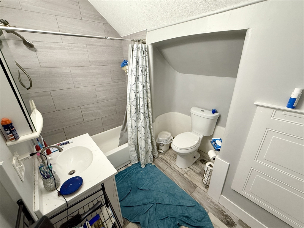 63 Langdon Street Springfield, MA 01104 - Photo 14 of 22 a view of living room with furniture and rug