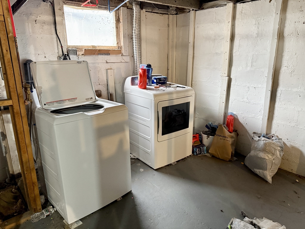 63 Langdon Street Springfield, MA 01104 - Photo 17 of 22 a utility room with a window dryer and washer