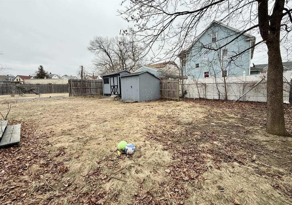 63 Langdon Street Springfield, MA 01104 - Photo 22 of 22 a large house with a large tree in front of it