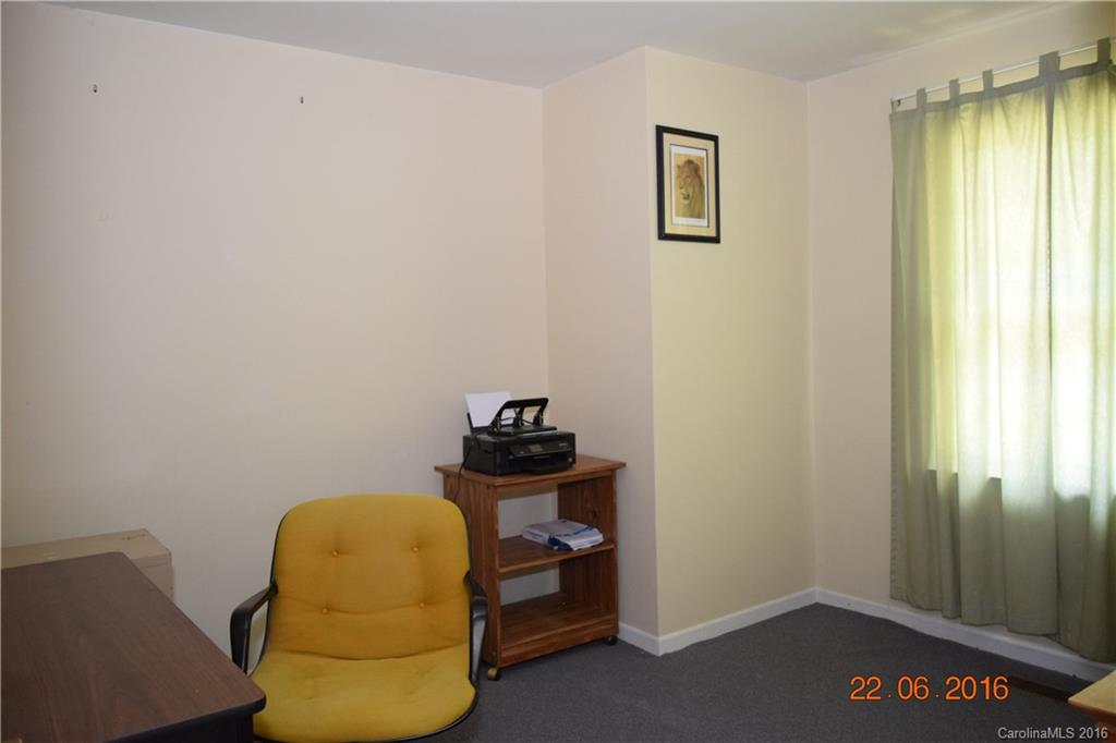 6745 Lowder Road Salisbury, NC 28147 - Photo 8 of 17 a room with a chair and a window
