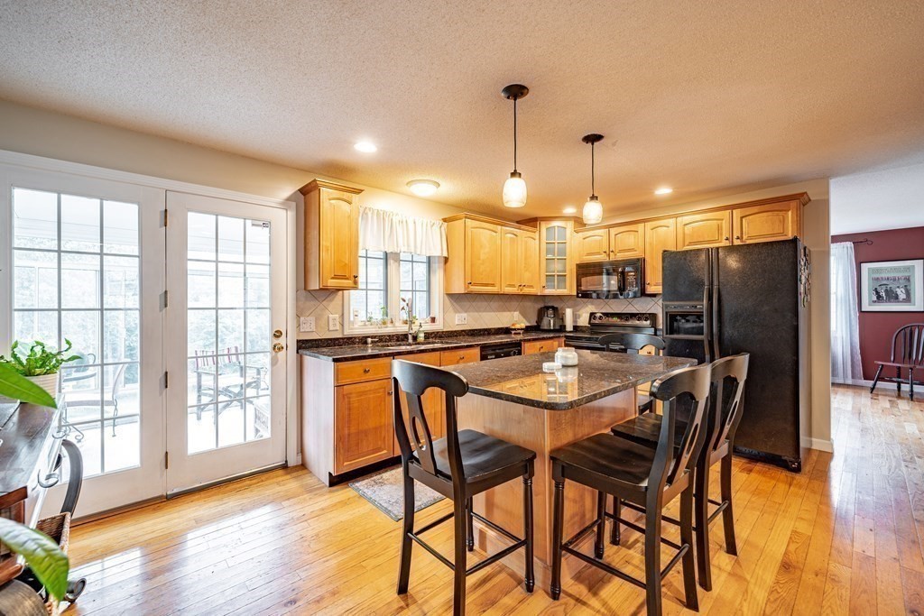 11 Gates Avenue Springfield, MA 01118 - Photo 4 of 42 a large kitchen with a table and chairs