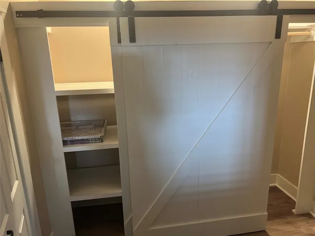 a bathroom with a sink toilet and a mirror