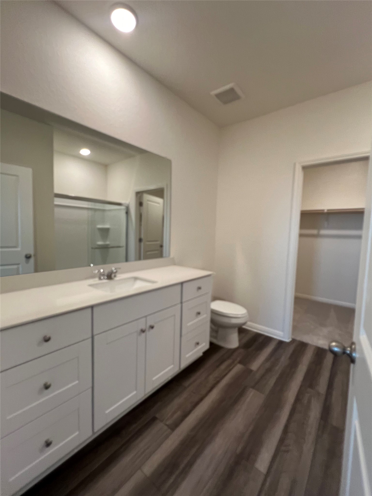 124 Rother Place Taylor, TX 76574 - Photo 4 of 12 A well-appointed bathroom features a spacious vanity with abundant storage and sleek flooring.