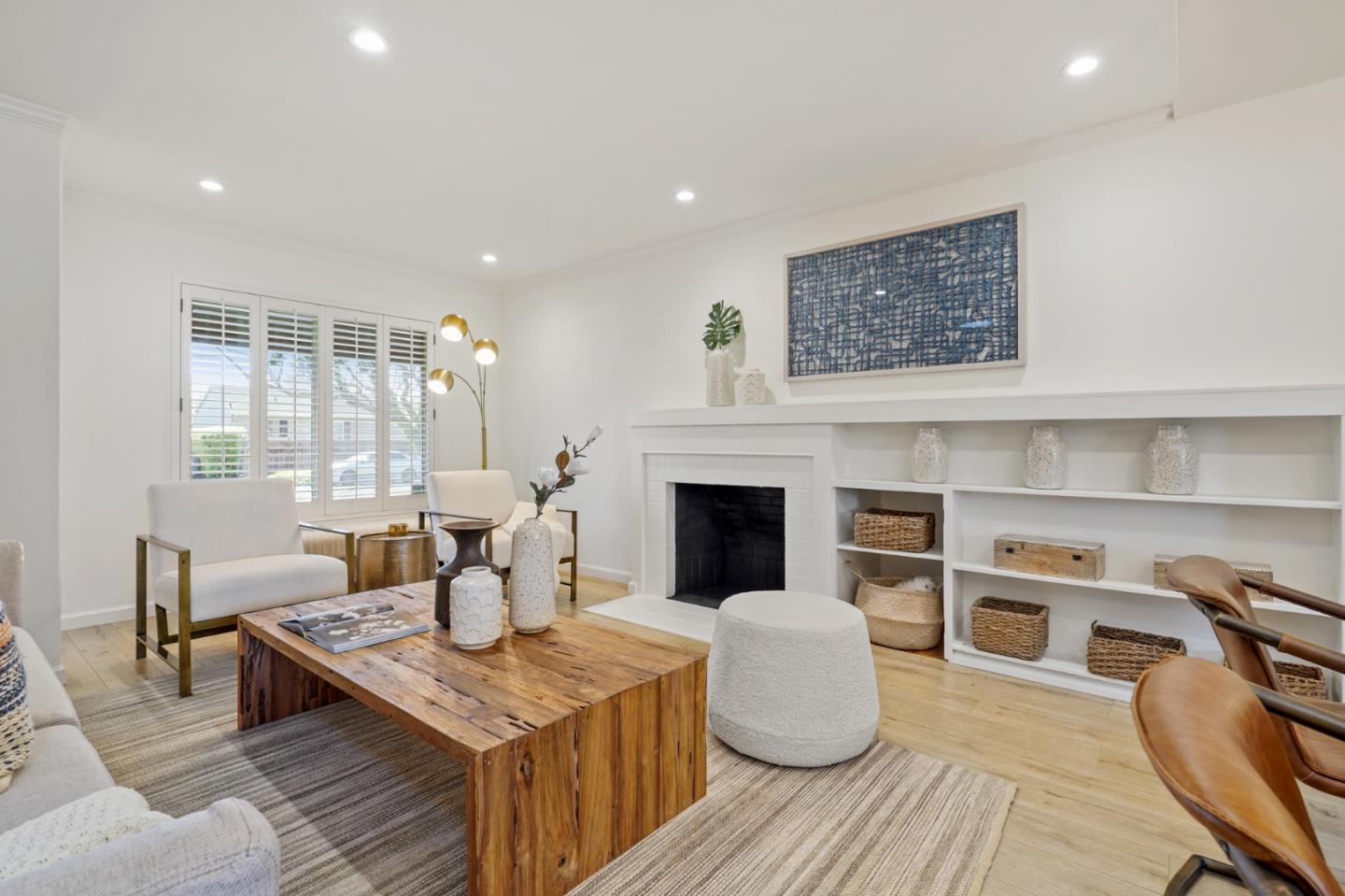418 Dwight Road Burlingame, CA 94010 - Photo 12 of 45 a living room with furniture a fireplace and a table