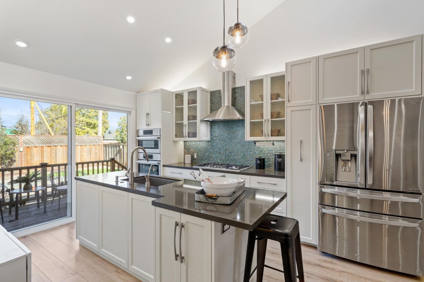 418 Dwight Road Burlingame, CA 94010 - Photo 15 of 45 a kitchen with counter top space and appliances