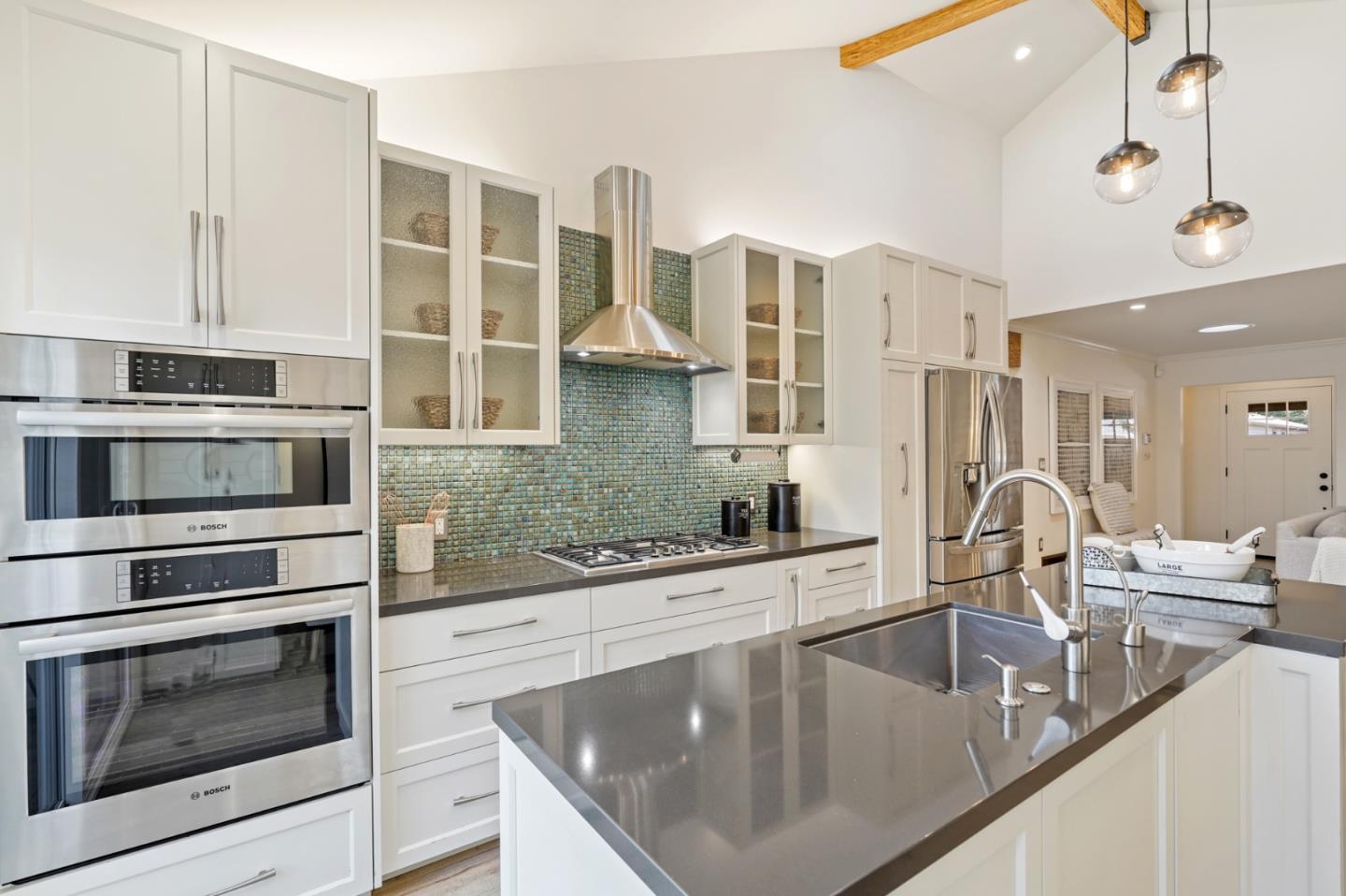 418 Dwight Road Burlingame, CA 94010 - Photo 16 of 45 a kitchen with stainless steel appliances granite countertop a sink and stove