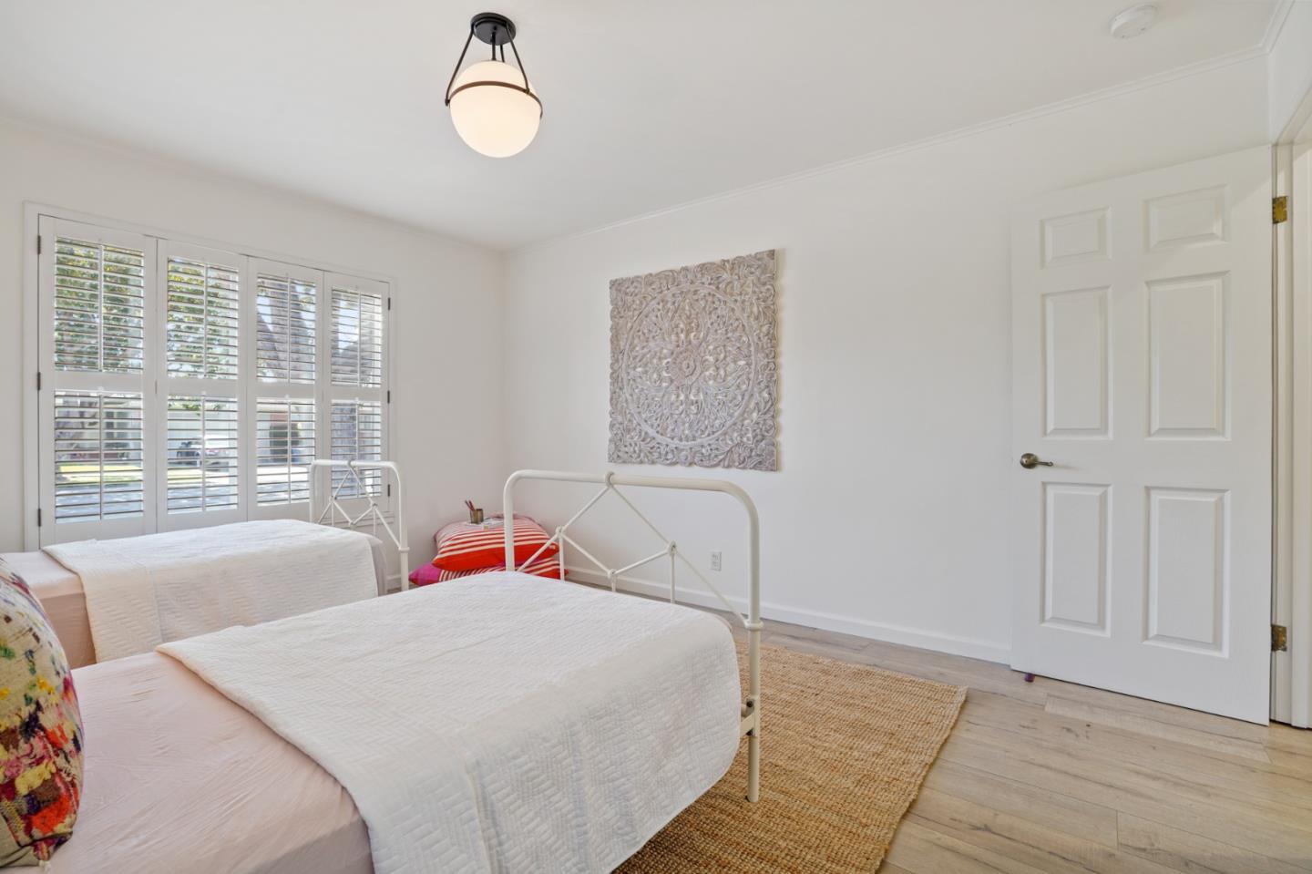 418 Dwight Road Burlingame, CA 94010 - Photo 22 of 45 a bedroom with a bed and a large window