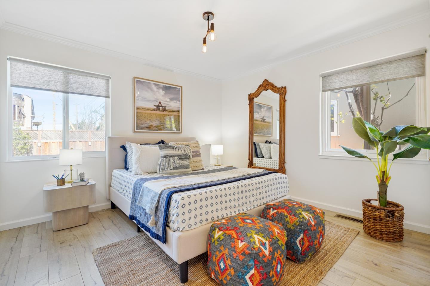 418 Dwight Road Burlingame, CA 94010 - Photo 26 of 45 a bedroom with a bed and wooden floor