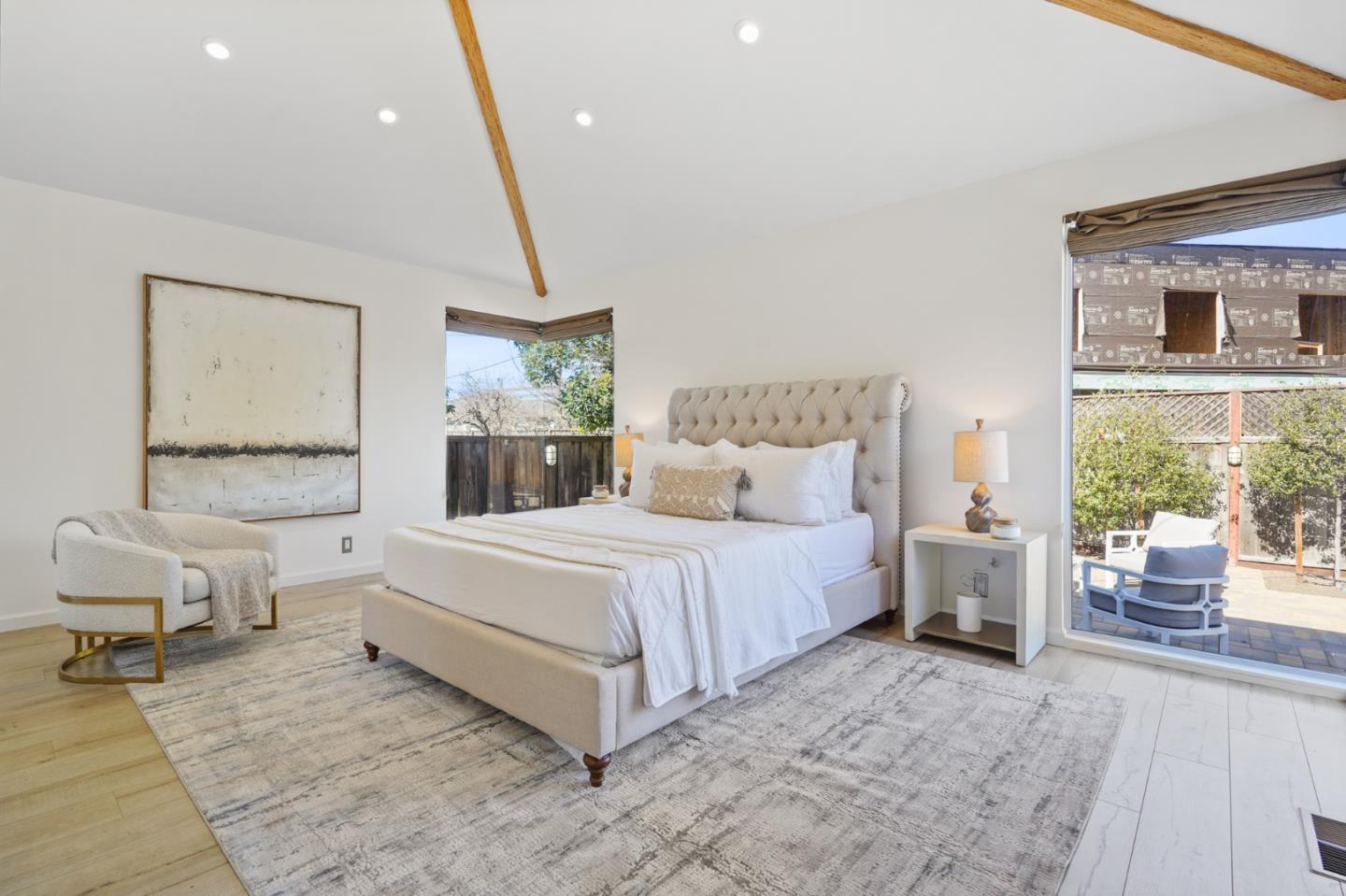 418 Dwight Road Burlingame, CA 94010 - Photo 30 of 45 a spacious bedroom with a bed and window