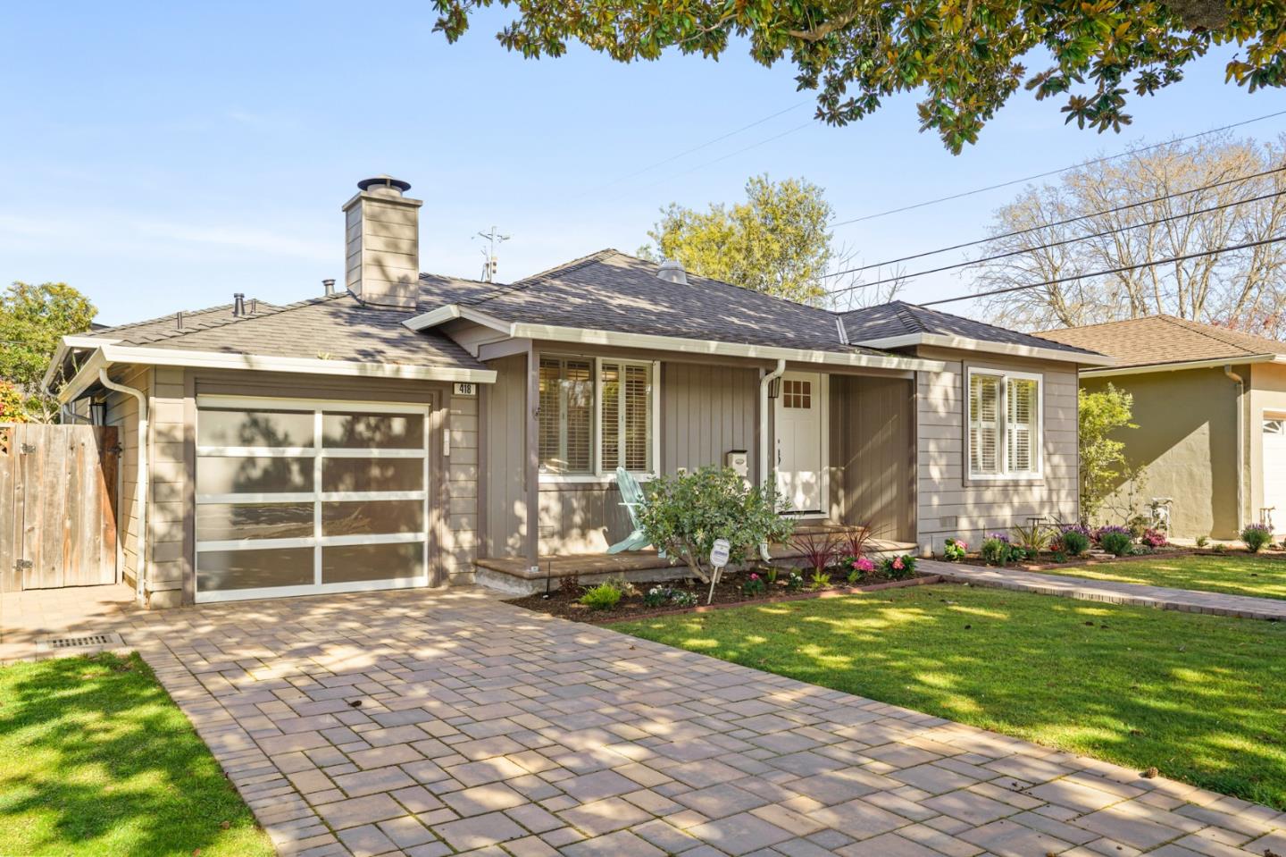 418 Dwight Road Burlingame, CA 94010 - Photo 3 of 45 a front view of a house with a yard and outdoor seating