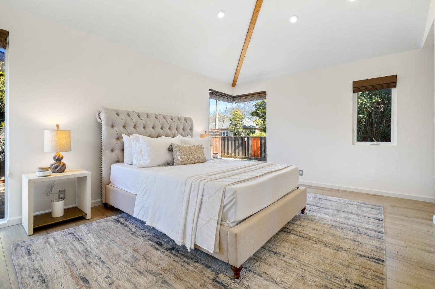 418 Dwight Road Burlingame, CA 94010 - Photo 33 of 45 a bed room with a bed and a night stand