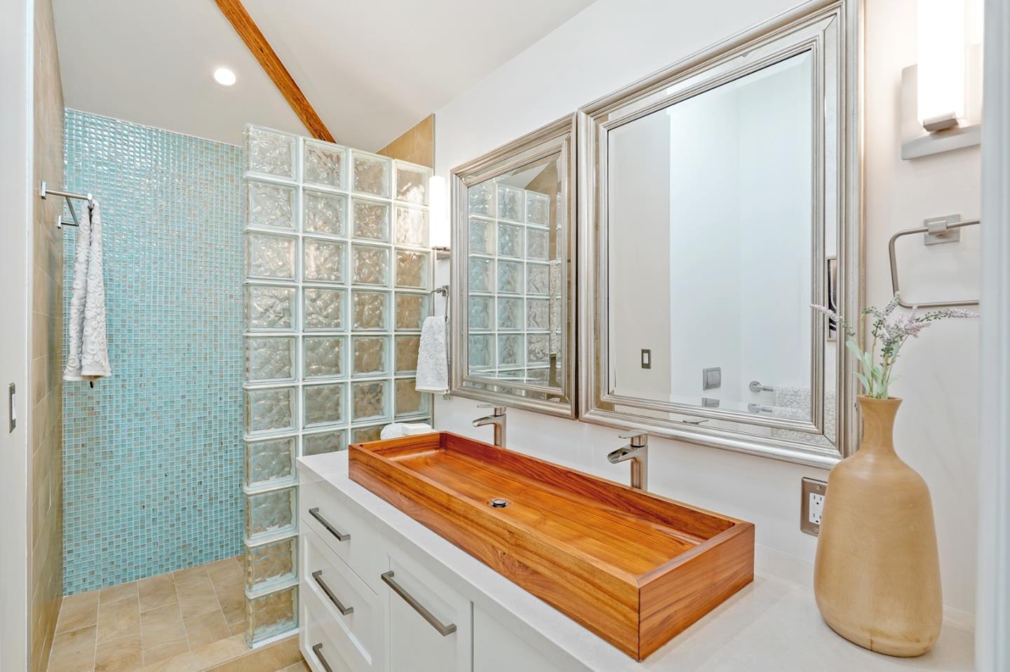 418 Dwight Road Burlingame, CA 94010 - Photo 35 of 45 a bathroom with a granite countertop sink and a mirror