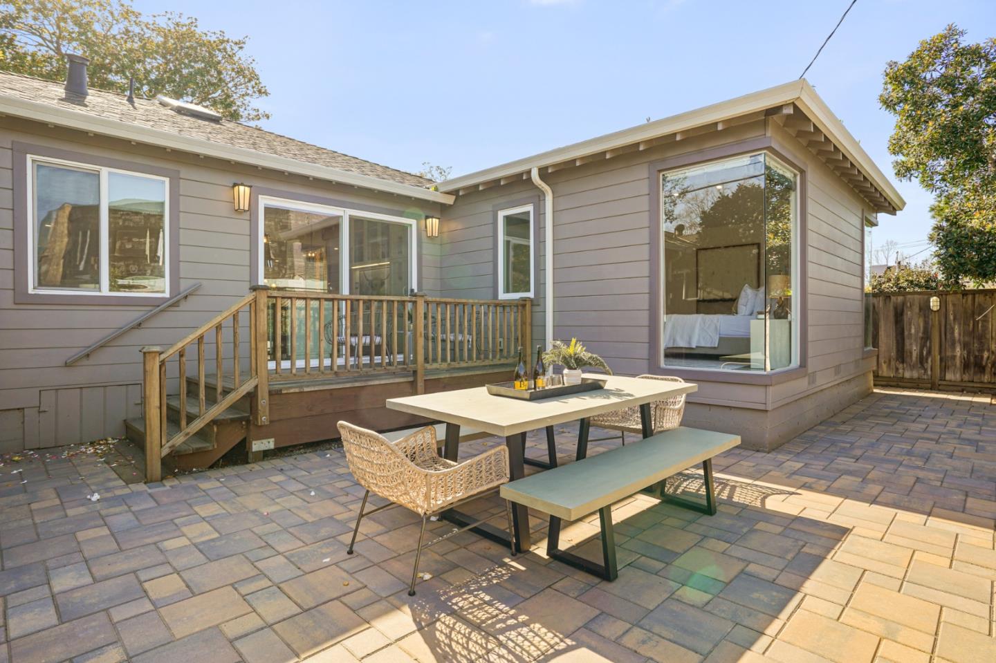 418 Dwight Road Burlingame, CA 94010 - Photo 39 of 45 a backyard of a house with table and chairs