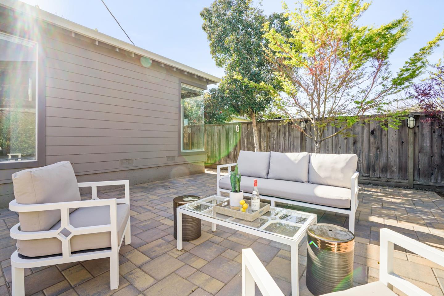 418 Dwight Road Burlingame, CA 94010 - Photo 41 of 45 a patio with patio a couch and chairs