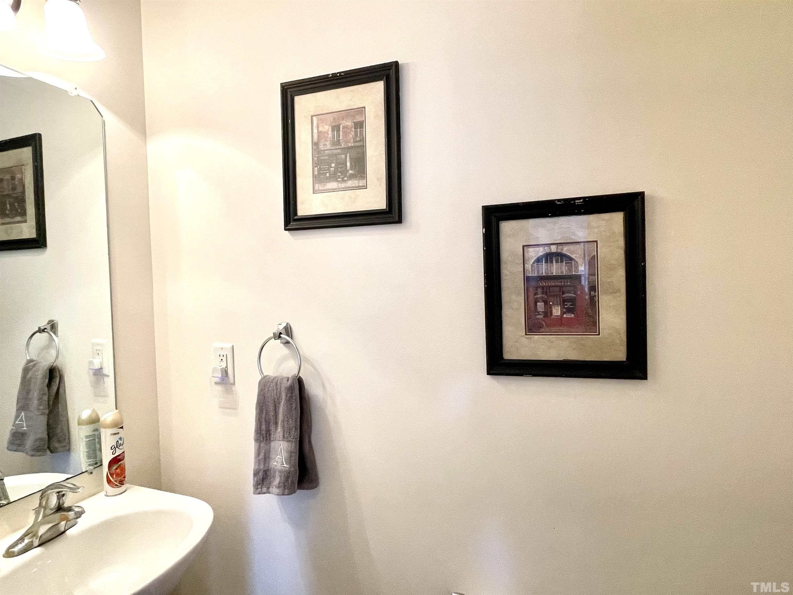 113 Graystar Road Apex, NC 27502 - Photo 12 of 24 a bathroom with a sink and a mirror