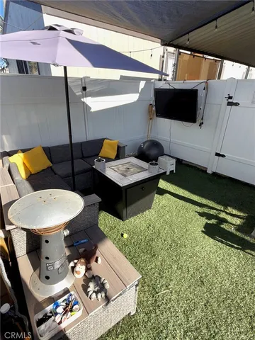 a view of a lounge chairs in the patio