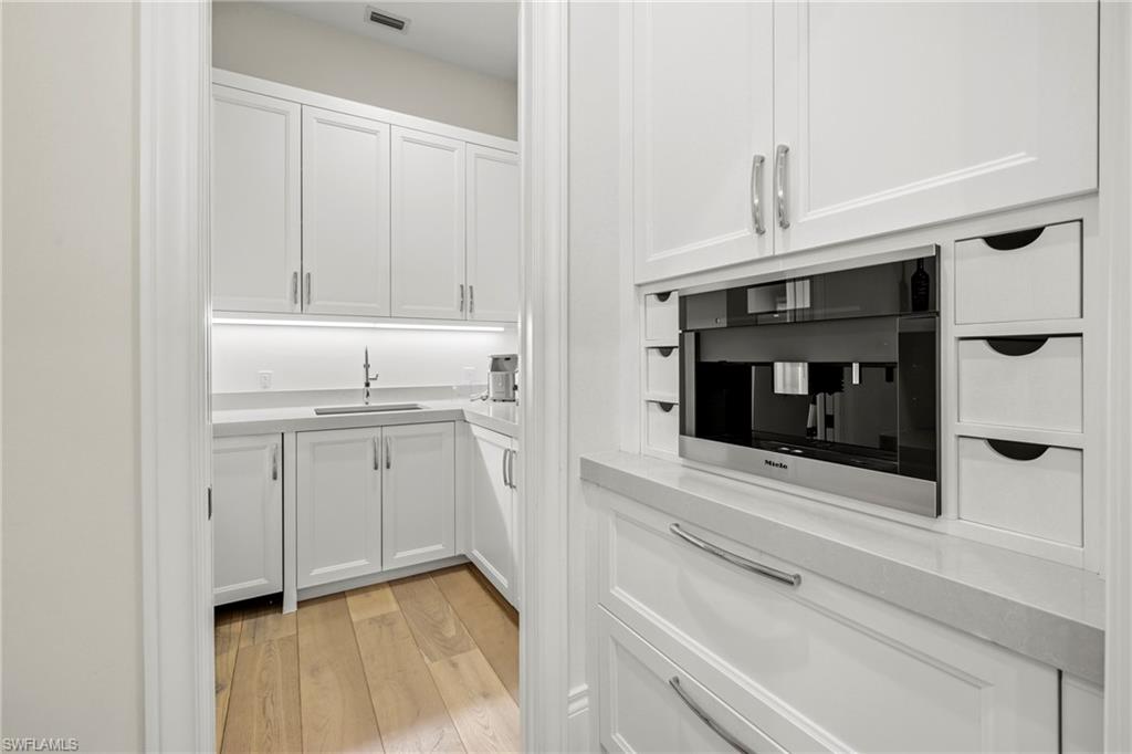 215 3rd Avenue North Naples, FL 34102 - Photo 11 of 47 Kitchen featuring expresso coffee maker.