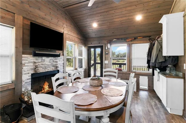 a kitchen with stainless steel appliances a refrigerator sink stove and cabinets