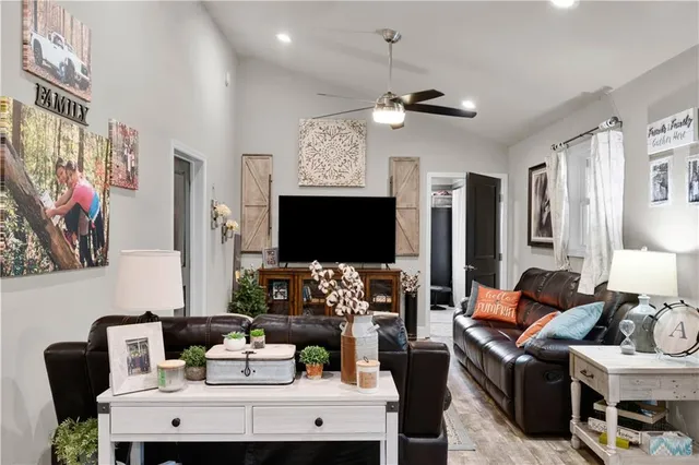 a bathroom with a double vanity sink a large mirror and shower