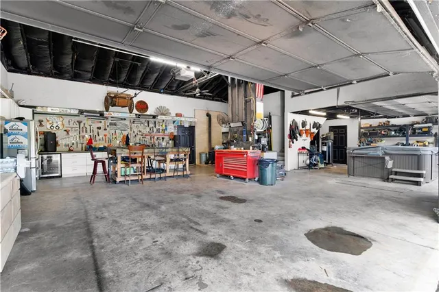 a view of a swimming pool with an outdoor seating and a yard