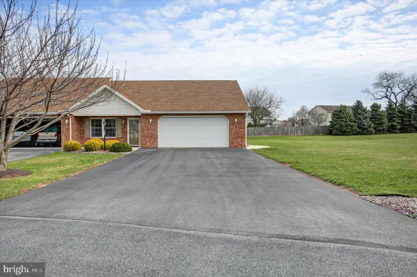 a house with garden in front of it
