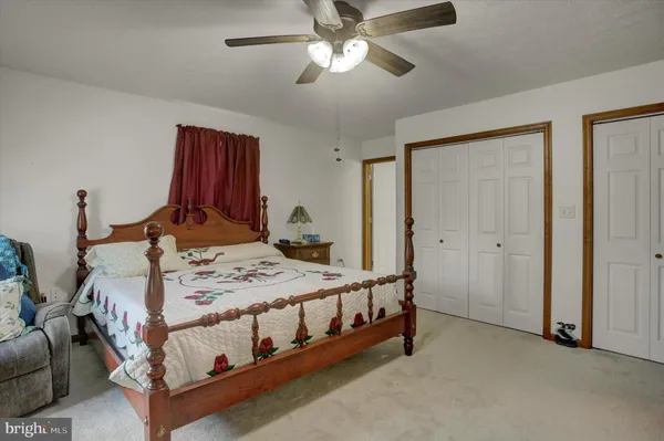 a bed room with a bed and a chandelier