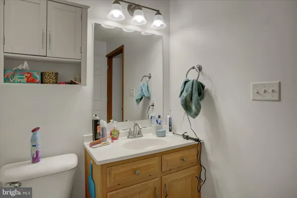 a bathroom with a sink a vanity and a mirror