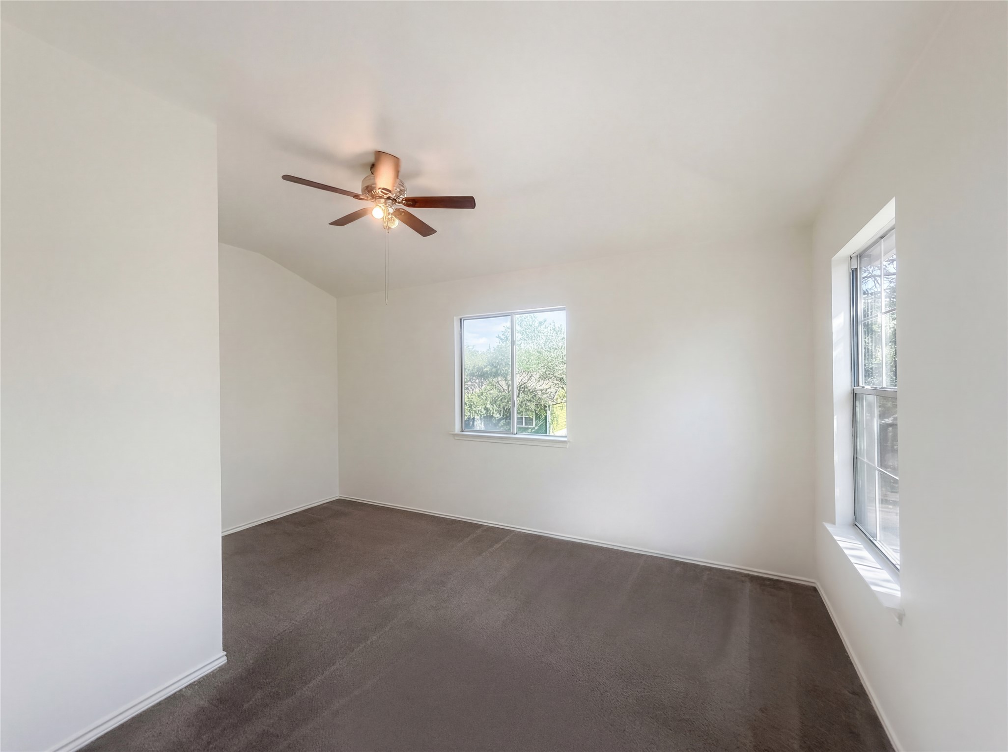 110 Strawn Kyle, TX 78640 - Photo 15 of 22 Unfurnished room featuring dark carpet and ceiling fan