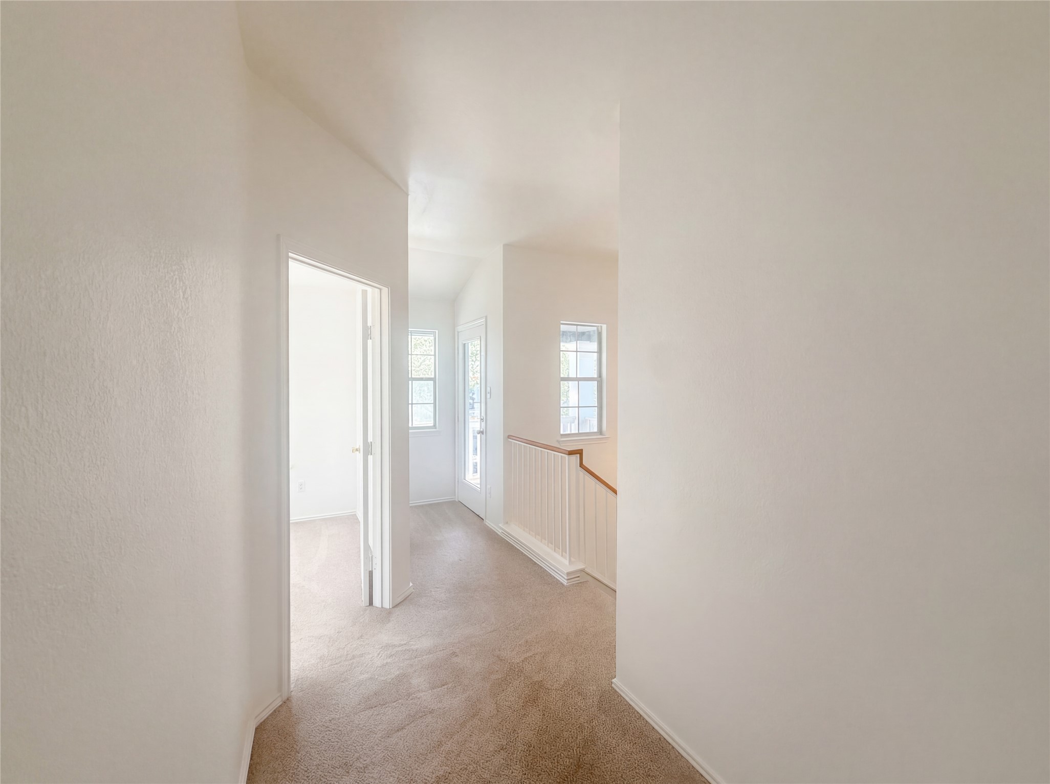 110 Strawn Kyle, TX 78640 - Photo 17 of 22 Hallway featuring light colored carpet and an upstairs landing