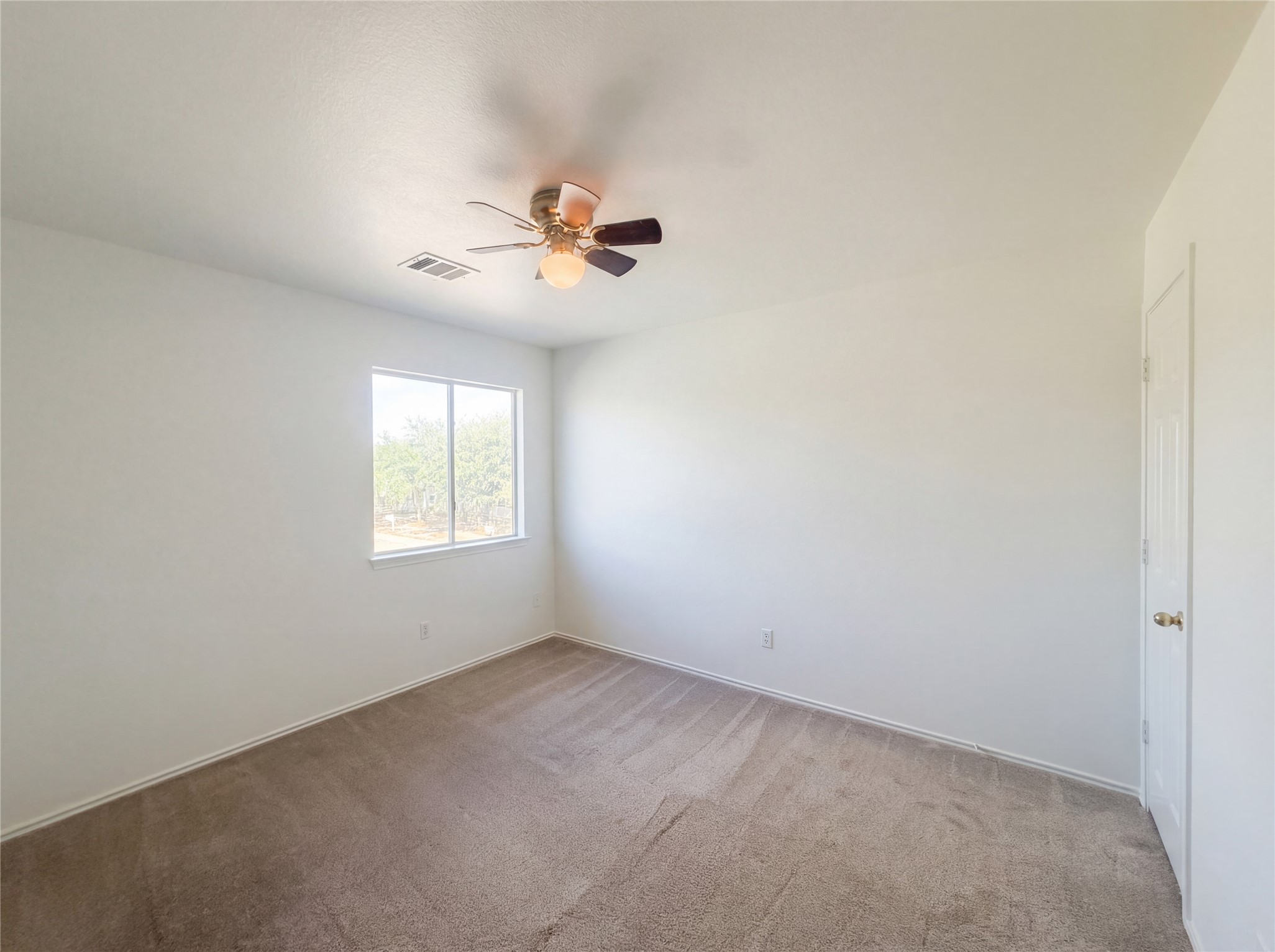 110 Strawn Kyle, TX 78640 - Photo 18 of 22 Unfurnished room with a ceiling fan and carpet flooring