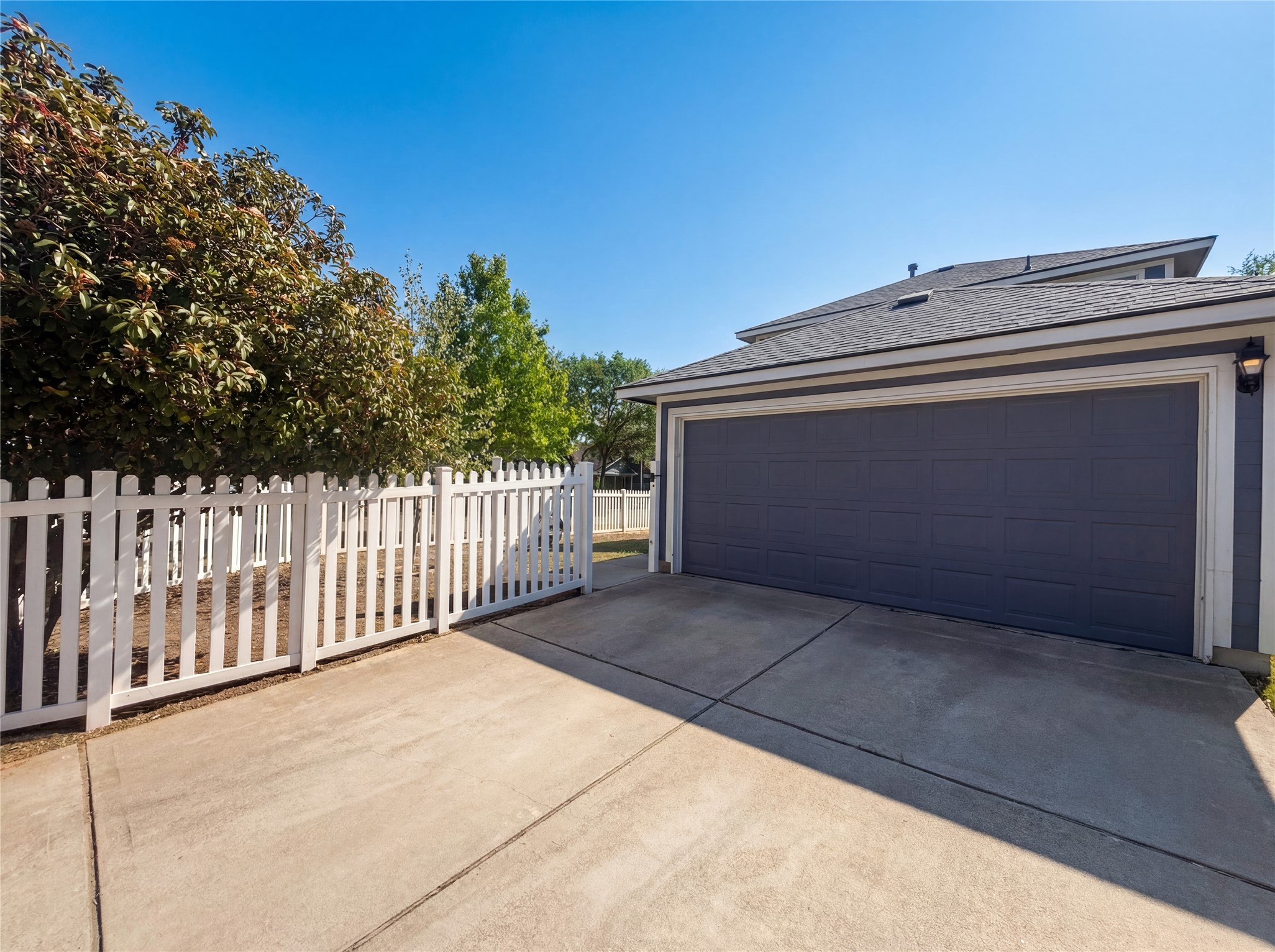 110 Strawn Kyle, TX 78640 - Photo 5 of 22 Garage with concrete driveway