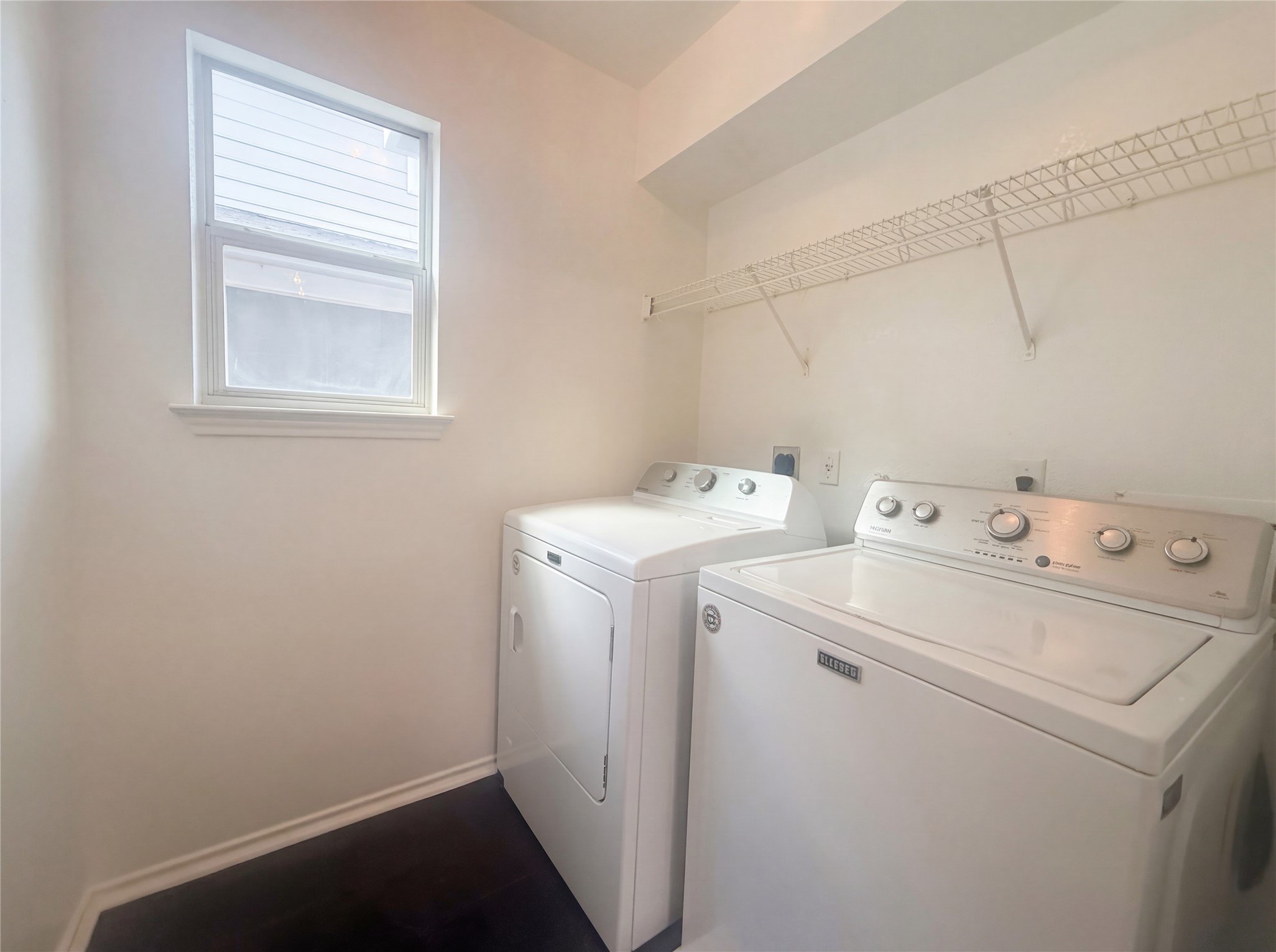 110 Strawn Kyle, TX 78640 - Photo 9 of 22 Laundry area with washing machine and dryer and baseboards